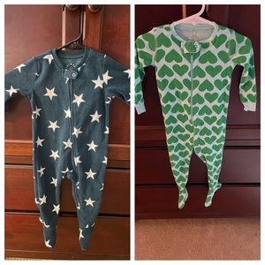 Two primary zip footed sleepers